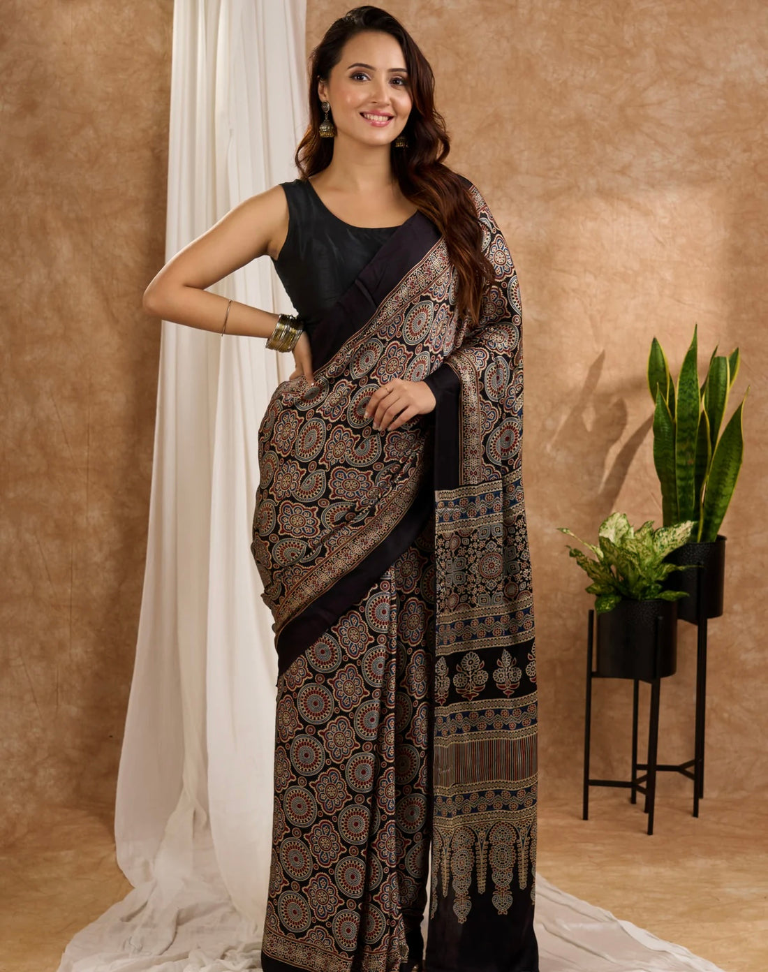 Ajrakh Print Border with Ajrakh Rich Pallu With Contrast Blouse.